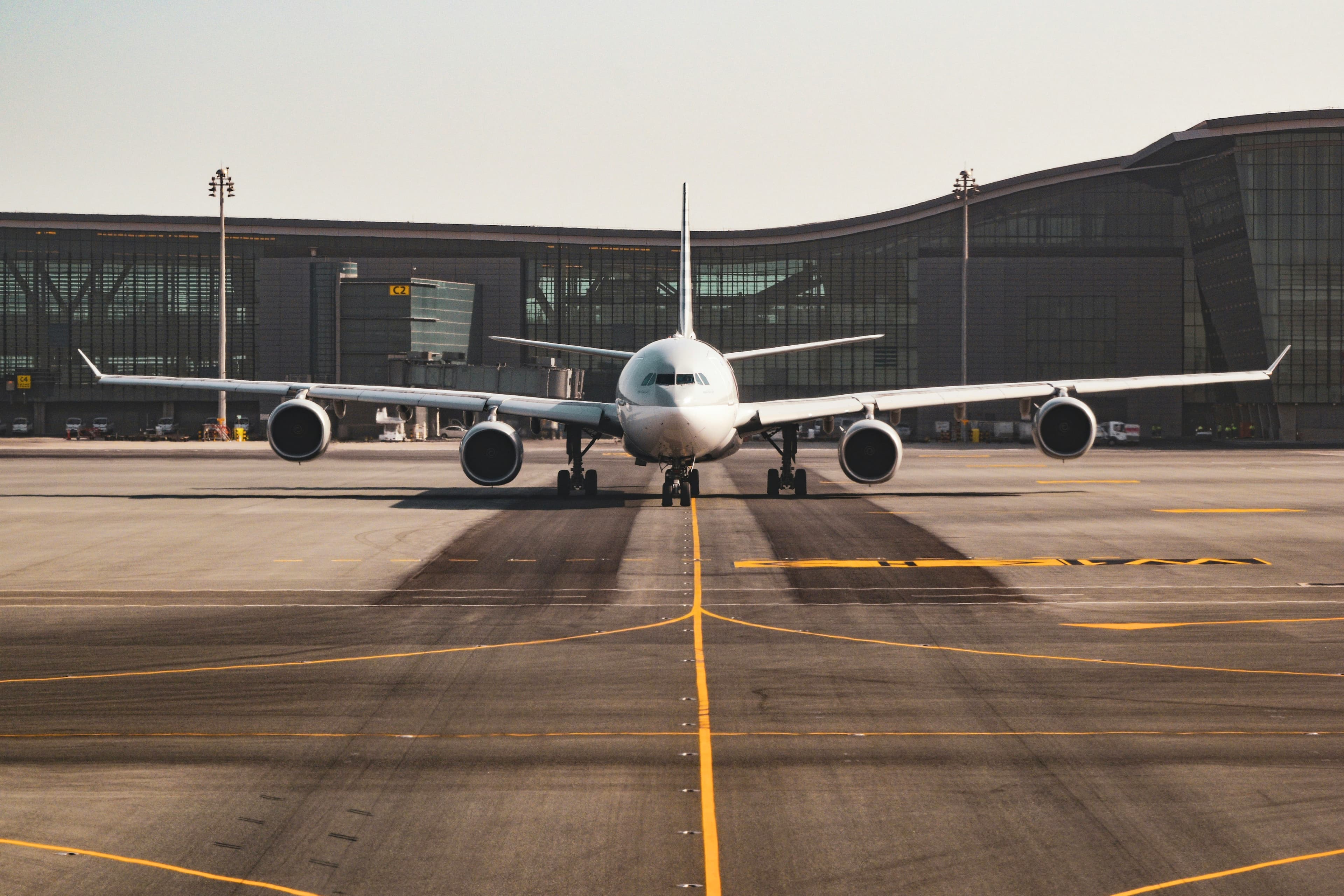 Passenger aircraft on the apron in front of an airport terminal